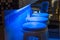 Empty stools along bar Illuminated in blue light