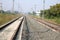 Empty straight single-way railways at summer sunny day