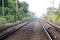 Empty straight single-way railways at summer sunny day