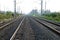 Empty straight single-way railways at summer sunny day