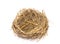 Empty straw nest with twigs on a white background