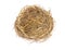 Empty straw nest with twigs on a white background