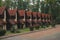 Empty street of beautiful Europe village shingle roof cottage houses exterior facade along road in park outdoor woodland area zone