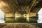 Empty street, beautiful light under a bridge in Lyon by winter day in February.