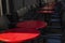 Empty street cafe. Round red tables with gray chairs