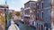 Empty street with old buildings in Venice, Italy