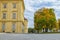 Empty street with paving stone and with colorful tree and blue sky in Vienna Austria at autumn