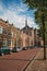 Empty street with semidetached brick houses at sunset