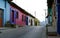 An empty street with typical Mexican houses