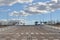 Empty street in an uninhabited city and blue sky with clouds