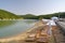 Empty sun loungers on the cypress lake in Sukko. Anapa. Russia