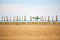 Empty sun lounges and closed parasols on the beach