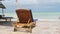 Empty Sunbed Stands Across from the Ocean on Paradise Beach, Zanzibar, Rear View