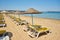 Empty sunbeds on ilica beach by the open sea, Cesme