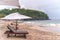 Empty sunbeds waiting for tourists on Virgin beach or Pasir Putih or Perasi Beach on Bali, Indonesia. Beautiful and clean tropical