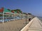 Empty sunloungers rows under sunshades