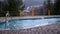 Empty Swimming Pool against the Backdrop of Rain with a View of the Mountains