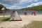 Empty swimming pool in Central Europe. Wooden jetty on the lake