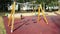 Empty swings with chains swaying at playground for child, moved from