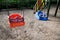 Empty swings on kindergarten playground. Unattended colorful swing set during coronavirus outbreak. Closed for children in