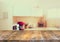 Empty table board and defocused white retro kitchen background