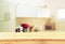 Empty table board and defocused white retro kitchen background