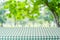 Empty table with green tablecloth over blur garden and bokeh background, for food and product display montage, spring and summer