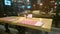 Empty table at restaurant, loneliness, city traffic outside