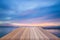 Empty table top of wooden table with sunset background