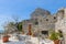 Empty tables in a cafe inside the old citadel in Budva