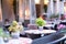 Empty tables of street cafes