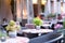 Empty tables of street cafes