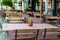 Empty tables waiting for customers at outdoor restaurant.