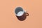 Empty tea cup on beige background. Coffee mug from above. Minimal concept Hard deep shadow. Flat lay, top view