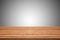 Empty teak wood table top on gray gradient background,space mont