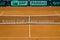 empty tennis clay court with net and judges