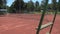 Empty tennis court and ladder for the referee