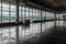 empty terminal with view of the tarmac, showcasing bustling airport in the background