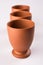 Empty terracotta mug or brown clay coffee cup or jar or drinking glass