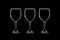 Empty three wine glass on black background