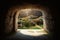 Empty tomb carved out of rock in a beautiful garden