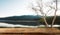 Empty top of wooden shelves on sky mountain and river trees front view background. For product display blur background image, for