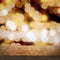 Empty top wooden table, blurred golden night background with lights and bokeh, focus on the tabletop