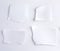 empty torn pieces of white paper on a white background