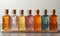 Empty transparent colored bottles on a light background.