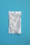 Empty transparent plastic zip lock bag on blue background, ziplock for medicines