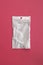 Empty transparent plastic zip lock bag with copy space on pink background, ziplock for medicines