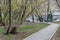 An empty treadmill in the city among the spring greenery of trees and shrubs. People on self-isolation