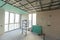 Empty under construction room in home or house with space on site. Interior. Old unfurnished room rental property