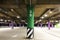 Empty underground parking lot with colorful columns on basement of shopping mall.